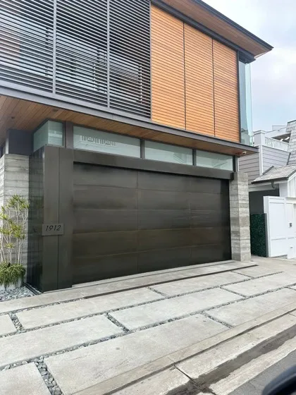 Horizontal wood slat modern garage door on a contemporary home