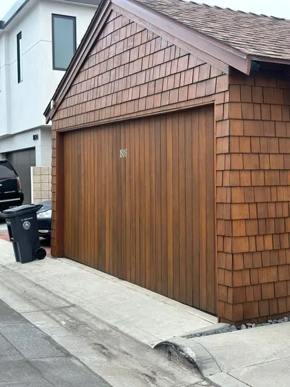Dark gray flush-panel modern garage door with windows