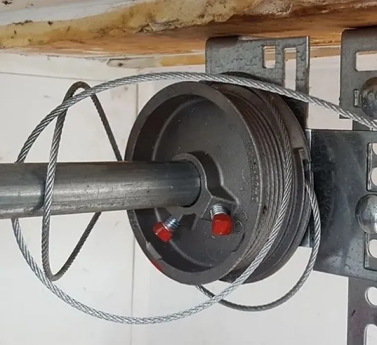 New lift cable seated on a garage door drum — garage door maintenance and tune-up in Orange County