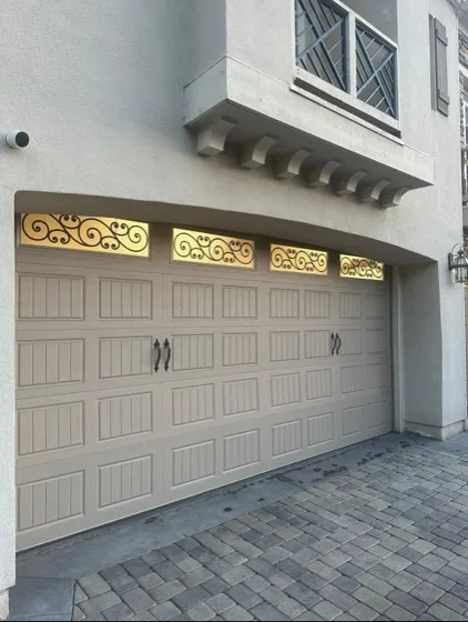 Ornate beige garage door with decorative windows — HOA style and color rules in Ladera Ranch