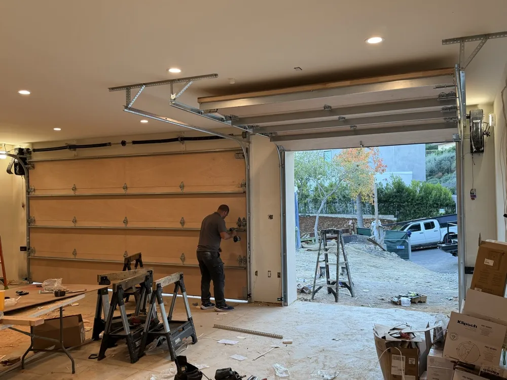 Technician working on a garage door renovation — same-day garage door repair in Orange County, CA